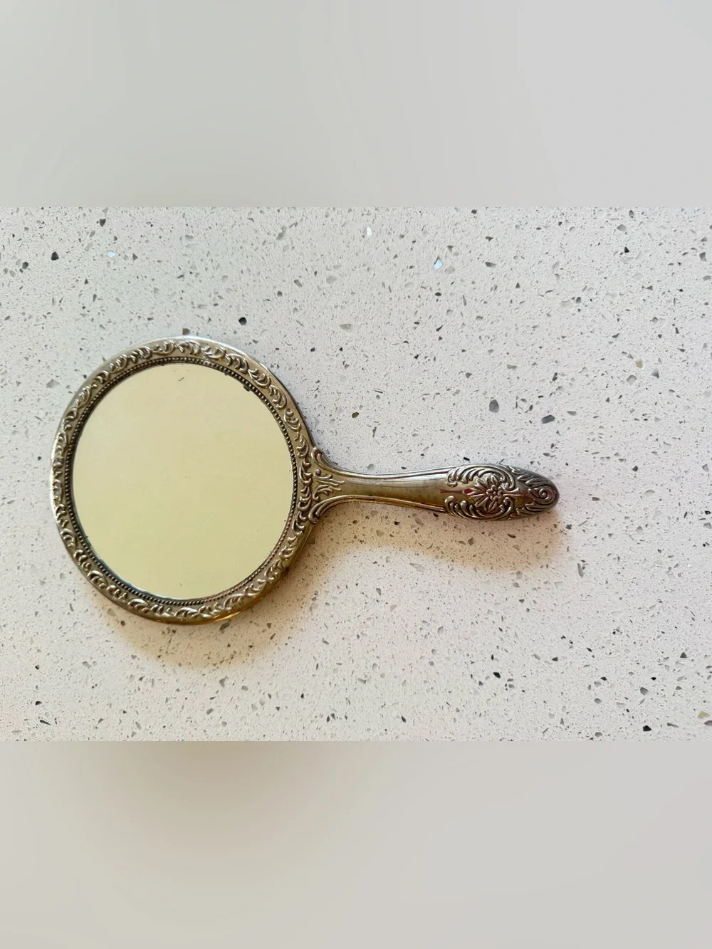 vintage silver-plated vanity hand mirror